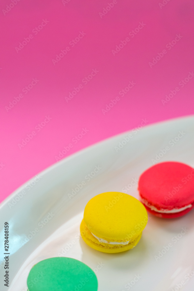 Close-up shot of colored macaroons in different position Close-up shot of colored macaroons in different position