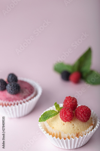 Muffins with blackberry and  raspberries. Delicious muffins with raspberries - sweet food