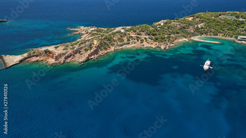 Aerial drone photo of rocky peninsula in Astir area or Asteras  Vouliagmenis  Attica  Greece