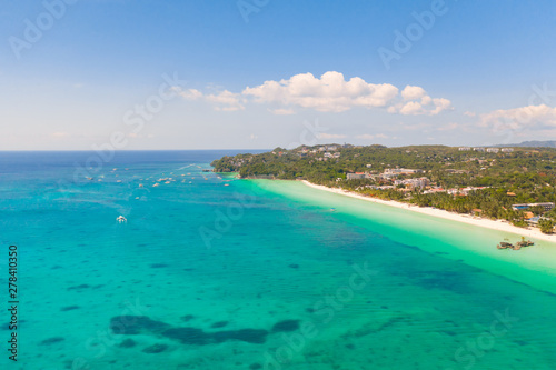The coast of the island of Boracay. White beach and clear sea. Seascape with a beautiful coast in sunny weather. Residential neighborhoods and hotels on the island of Boracay, Philippines, view from © Tatiana Nurieva