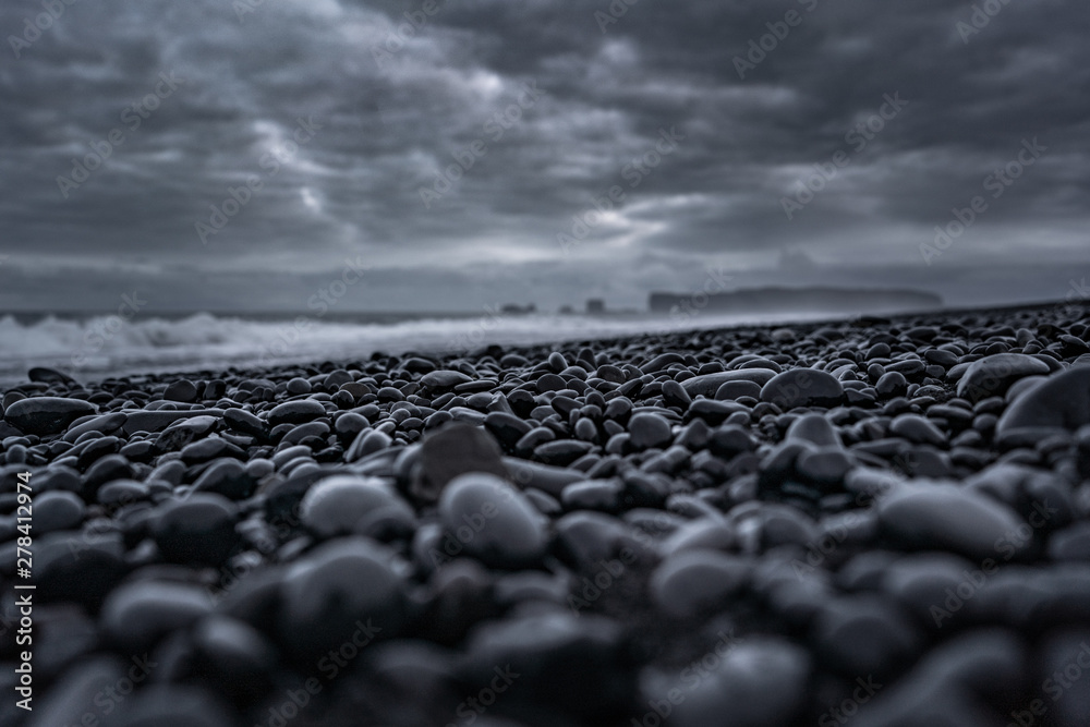 Fototapeta premium Black beach in Iceland with a dramatic sky