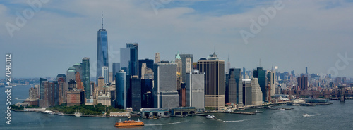 Photography Manhattan skyscrapers in New York city with blue skies in the background