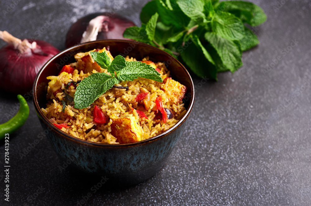 vegetarian paneer biryani at black background. paneer biryani is