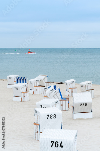 Beach - chairs on the island Sylt. Germany.  Summer cloudy weather. photo