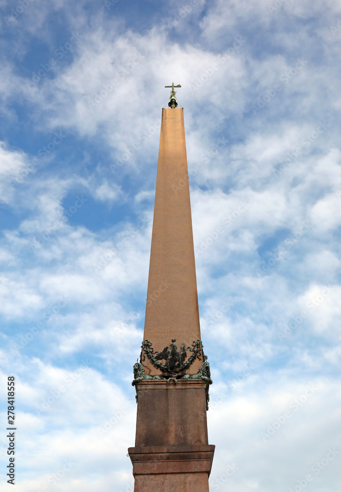 egyptian obelisk with  latin text that means Christ wins Christ