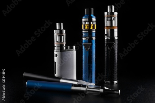 electronic cigarettes or vaping devices on black background