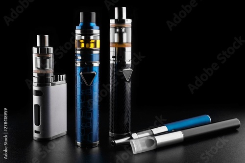 electronic cigarettes or vaping devices on black background