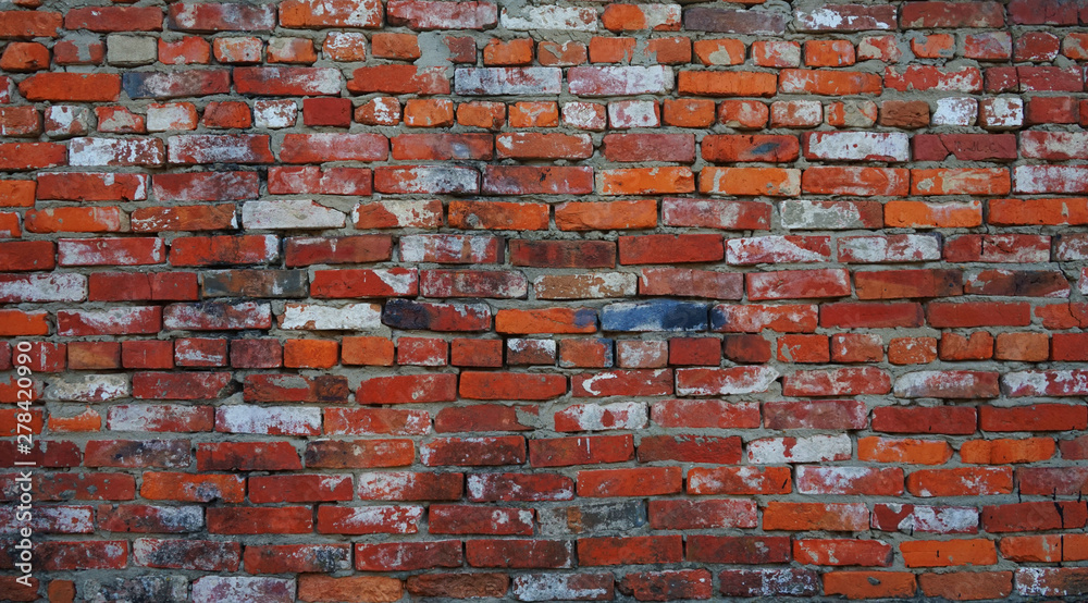 Naklejka premium red brick wall background. Grunge texture. 