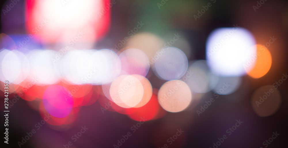 Blurred street lights, urban abstract background. defocused image of night city. Vehicles on the road.