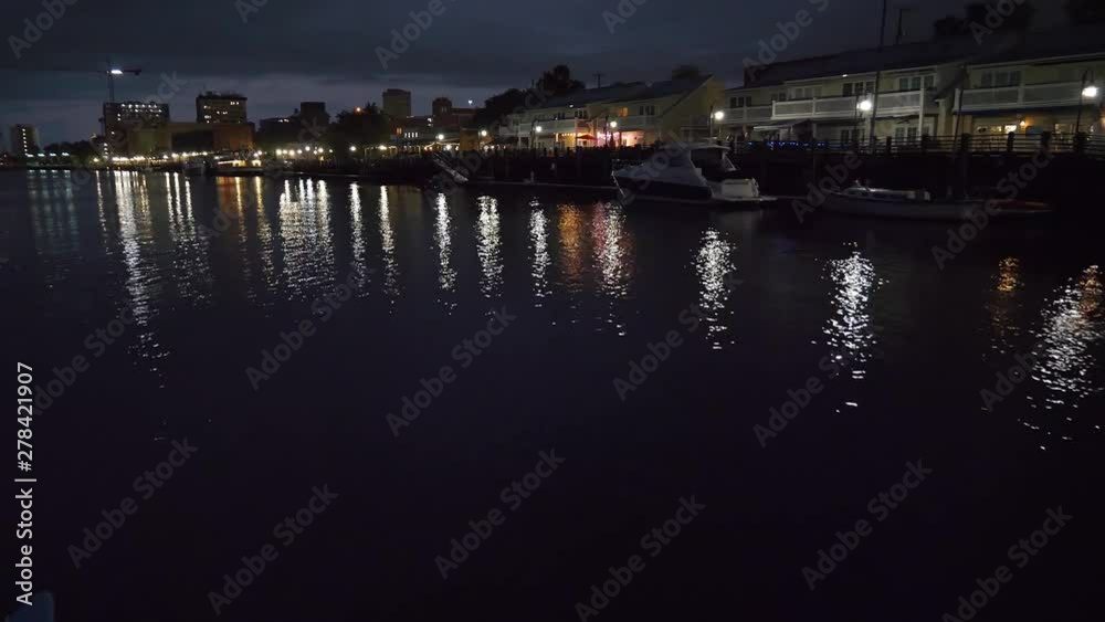 floating along a river and looking at the city reflecting off the water floating along a river and looking at the city reflecting off the water