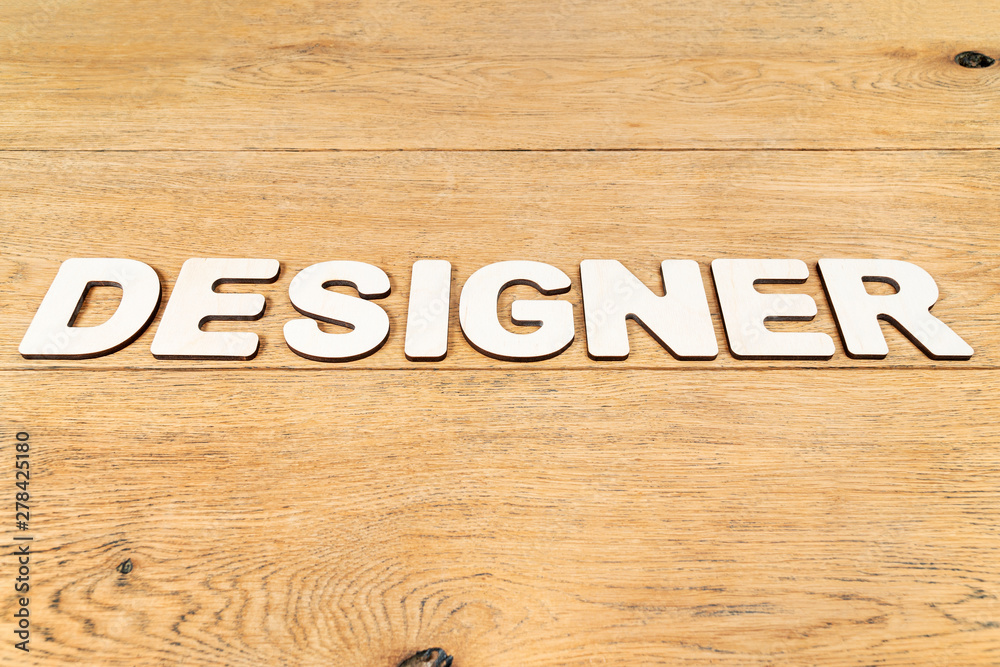 Word designer on a wooden table