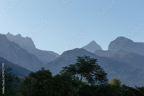 Beautiful landscape in the mountains at sunset. Lovely view of the Taurus Mountains at sunset. Soft sunlight falls on the mountain tops. Kemer  Turkey. Postcard view