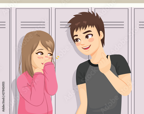 Young teenager happy boy talking to shy girl in front of school lockers