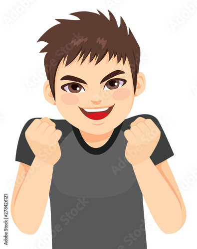 Happy young energetic teenager boy excited with fists up