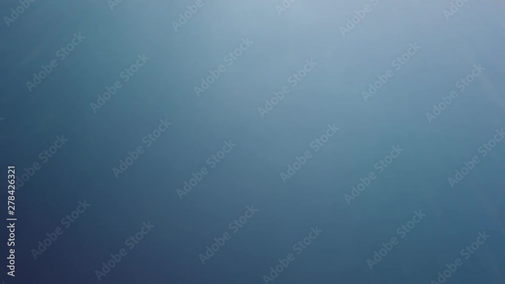 Straw hat is pulled away from lens to reveal clear blue summer sky. Ready for opening title Straw hat is pulled away from lens to reveal clear blue summer sky. Ready for opening title