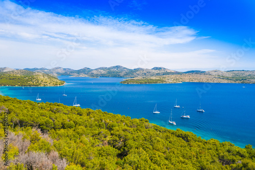 Aerial view of the blue bay and small islands in nature park Telascica, Croatia, Dugi otok, yachts anchored on shore