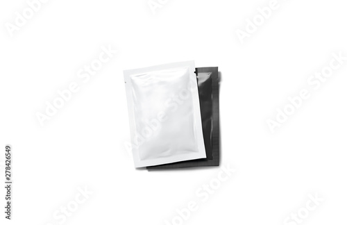 Blank white sachet packet on black stack mockup, isolated, top view, 3d rendering. Empty seasoning case with salt covering pepper mock up. Clear condiment pair with sauce for food.