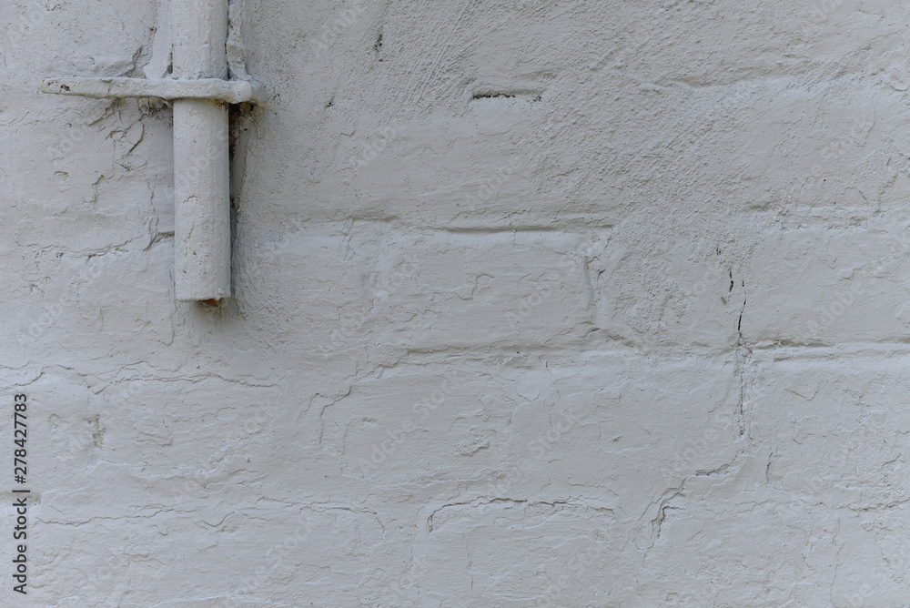 Old white roughly created brick wall painted with white paint, close up, copy space Old white roughly created brick wall painted with white paint, close up, copy space