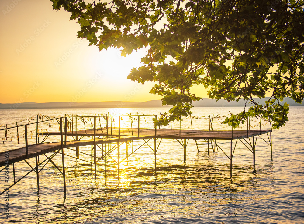 Fototapeta premium Pier with sunset at lake Balaton