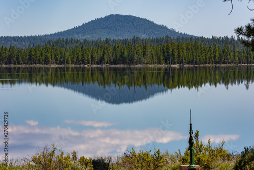 Eastern Oregon scenery reflected in the calm waters of Thompson Reservoir, in the Fremont Winema National Forest photo