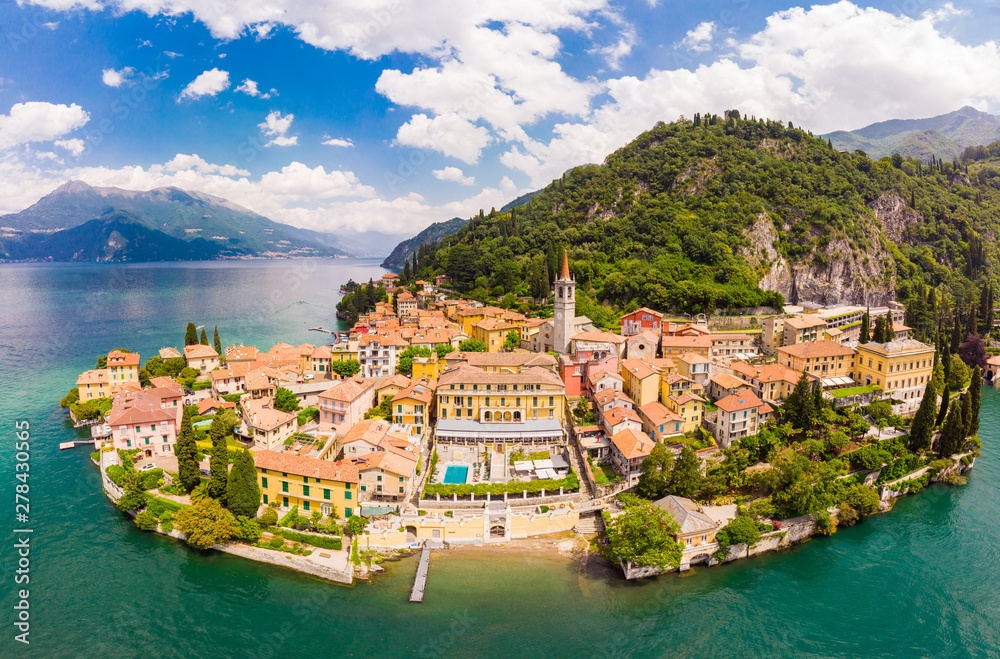 Beautifull aerial panoramic view from the drone to the Varenna - famous old Italy town on bank of Como lake. High top view to Water landscape with green hills, mountains and city in sunny summer day. - obrazy, fototapety, plakaty 