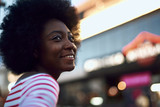 Beautiful afro-american woman looking away and smiling