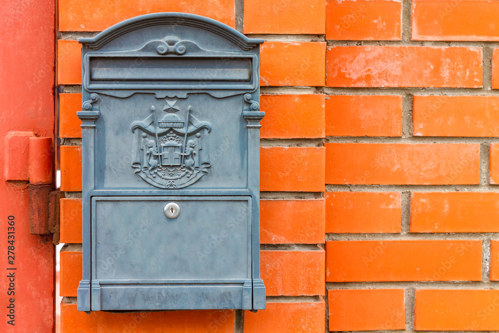 A beautiful mailbox hangs waiting for newspapers, parcels and letters. A beautiful mailbox hangs waiting for newspapers, parcels and letters.