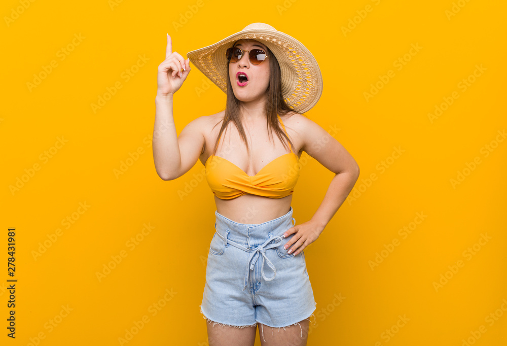 Young caucasian woman wearing a straw hat, summer look having an idea, inspiration concept. Young caucasian woman wearing a straw hat, summer look having an idea, inspiration concept.
