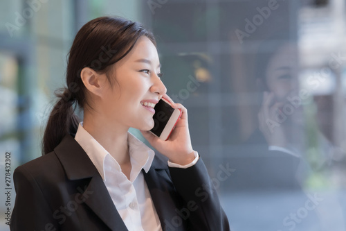 Asian businesswoman talking on mobile phone