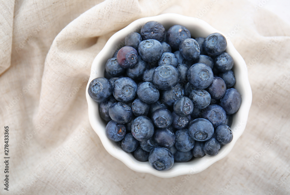 Bowl with fresh blueberry on table Bowl with fresh blueberry on table