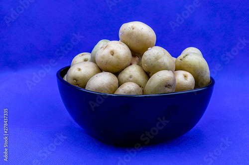 Baby potatoes in a black bowl against a colourful back drop. Calgary, Alberta, Canada