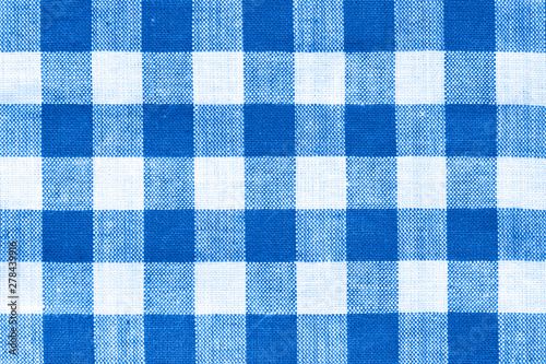 close macro view of white and royal blue squared pattern fabric texture