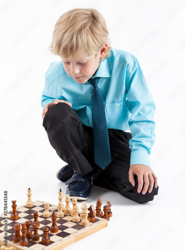 Girl and boy playing chess at home. - a Royalty Free Stock Photo from  Photocase