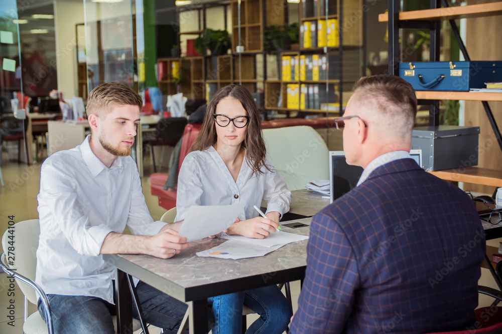 Couple meeting with financial advisor. Businessman with customers Couple meeting with financial advisor. Businessman with customers