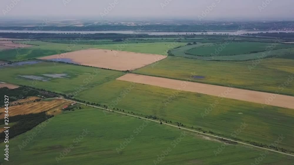 Catastrophic floods in the fields by the river and the village, aerial view, view from the sky Catastrophic floods in the fields by the river and the village, aerial view, view from the sky