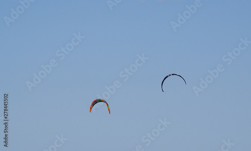 Two kite surfers over the Mediterranean Sea 