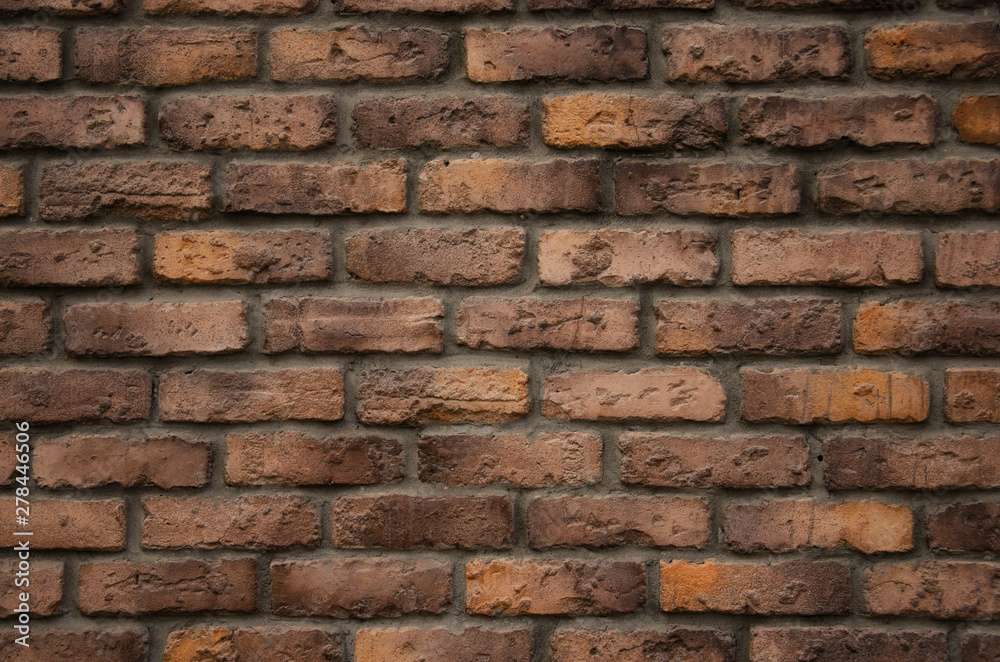 Obraz premium Dark red and yellow brick wall background