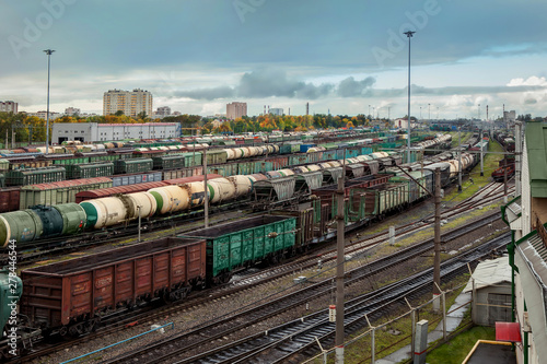 Tanks and cargo carriages on freight railway station