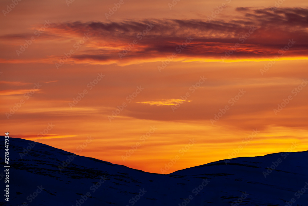 Silhouette hills during sunset in the mountains of Funäsfjällen, Sweden.	