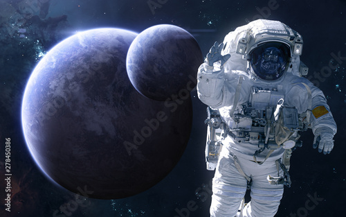 Fototapeta Naklejka Na Ścianę i Meble -  Astronaut on background of exoplanets in deep space. Science fiction. Elements of this image furnished by NASA