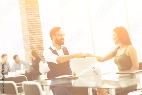 business handshake of a businessman and businesswoman