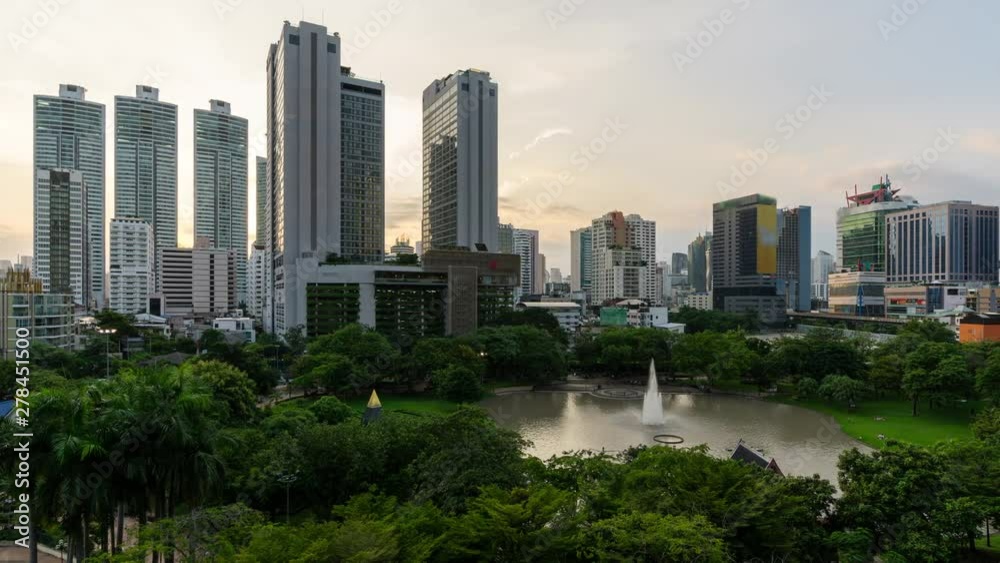 Time lapse of sunset over the park in the middle of business district Time lapse of sunset over the park in the middle of business district
