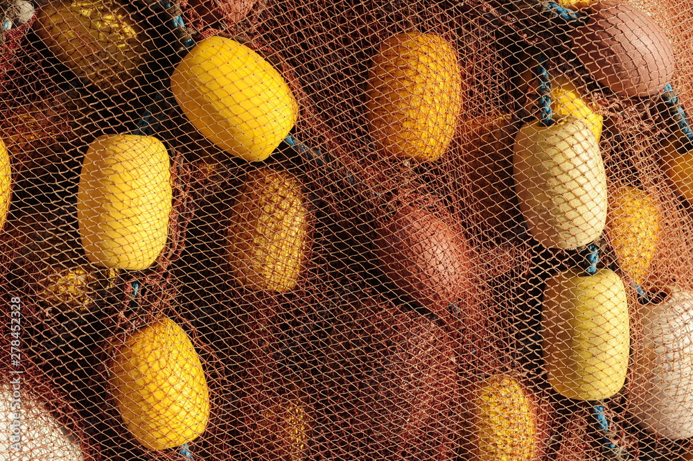 Fishing net with floats. Fishing nets drying on the dock Fishing net with floats. Fishing nets drying on the dock