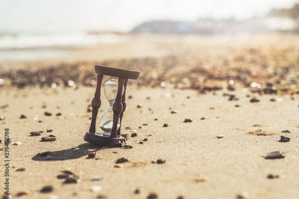 Hourglass on the beach, ocean. The concept of transience of time. Hourglass on the beach, ocean. The concept of transience of time.