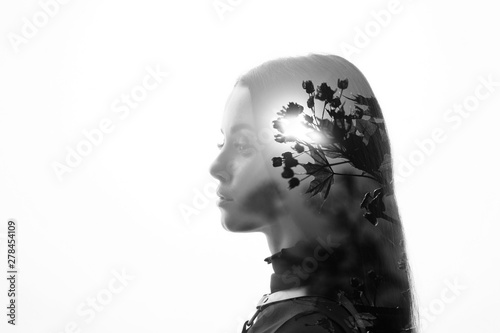 Double exposure of a female face. Abstract black and white woman portrait. Digital art.