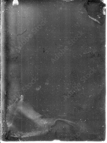 A real, black and white large-format spoiled photo with dust and scratches. Glass photographic plate with scratches, dust, dirt, out of focus image.