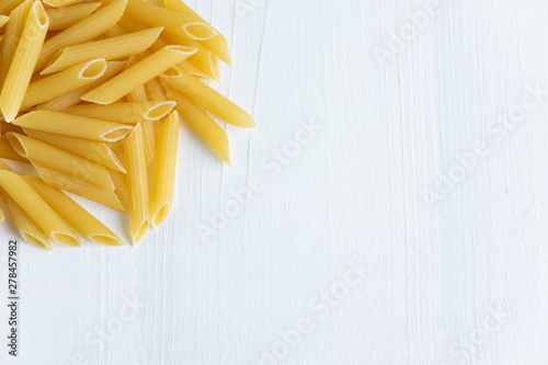 Closeup of dry pasta. Background for culinary banner with pasta.