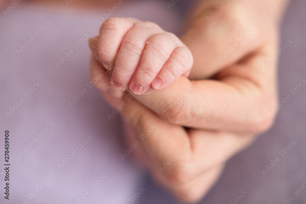 Newborn baby clenched fingers of his mother's finger Newborn baby clenched fingers of his mother's finger