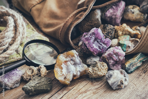 Schilderij op canvas Mineral stones collection and kit of geologist - backpack, map, magnifying glass, rope