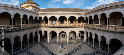 The patio from Casa de Pilatos, an Andalusian palace in Seville, Spain with it's mudejar style, Roman and Greek statues.